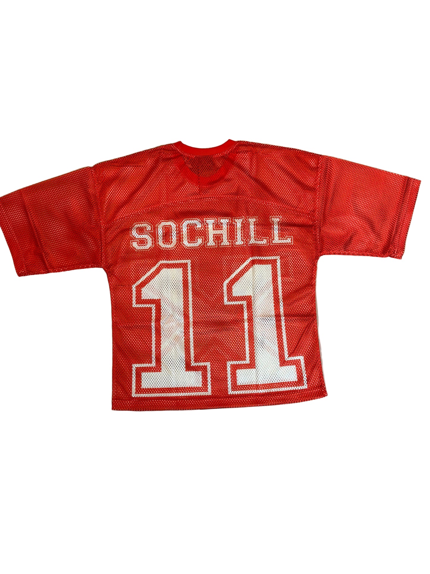 Red sports jersey with a logo on a wooden floor